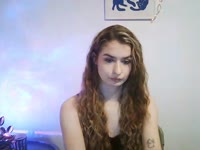 Hey, I’m Nina – blonde hair, green eyes, and tattoos that love to tell their own stories. My taste in music? Somewhere between Doja Cat’s groove and Rammstein’s fire ? I adore singing, dancing, and just vibing with the right energy. Sometimes I’m your sweet daydream, sometimes your wild rock chick – depends on which song is playing ?